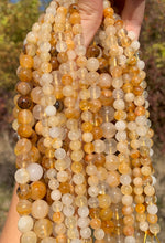 Charger l'image dans la galerie, Perles en quartz hématoïde jaune entre 6 et 10mm