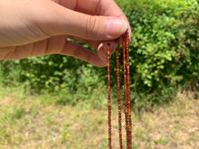 Charger l'image dans la galerie, Perles en grenat hessonite facettées entre 2 et 4mm