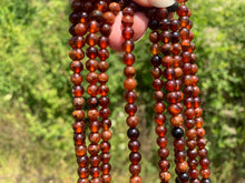 Charger l'image dans la galerie, Perles en grenat hessonite entre 6 et 10mm