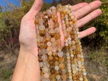 Charger l'image dans la galerie, Perles en quartz hématoïde jaune entre 6 et 10mm