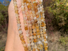 Charger l'image dans la galerie, Perles en quartz hématoïde jaune entre 6 et 10mm