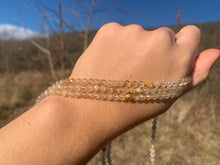 Charger l'image dans la galerie, Perles en quartz à inclusions de rutile facettées entre 2 et 5,5mm