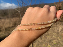 Charger l'image dans la galerie, Perles en quartz rutile facettées 3 x 4mm