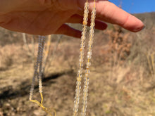 Charger l'image dans la galerie, Perles en quartz rutile facettées 3 x 4mm