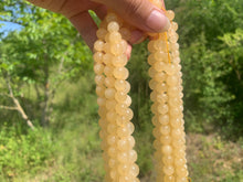 Charger l'image dans la galerie, Perles en calcite jaune entre 6 et 10mm