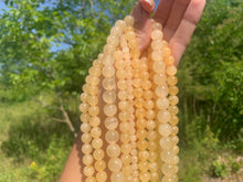 Charger l'image dans la galerie, Perles en calcite jaune entre 6 et 10mm