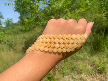 Charger l'image dans la galerie, Perles en calcite jaune entre 6 et 10mm