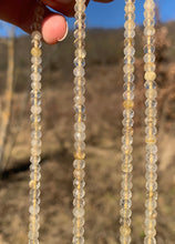 Charger l'image dans la galerie, Perles en quartz rutile facettées 3 x 4mm