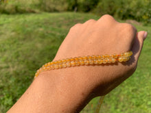 Charger l'image dans la galerie, Perles en quartz à inclusions de rutile entre 4 et 12mm QRU