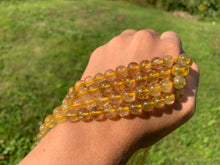 Charger l'image dans la galerie, Perles en quartz à inclusions de rutile entre 6 et 12mm QRD